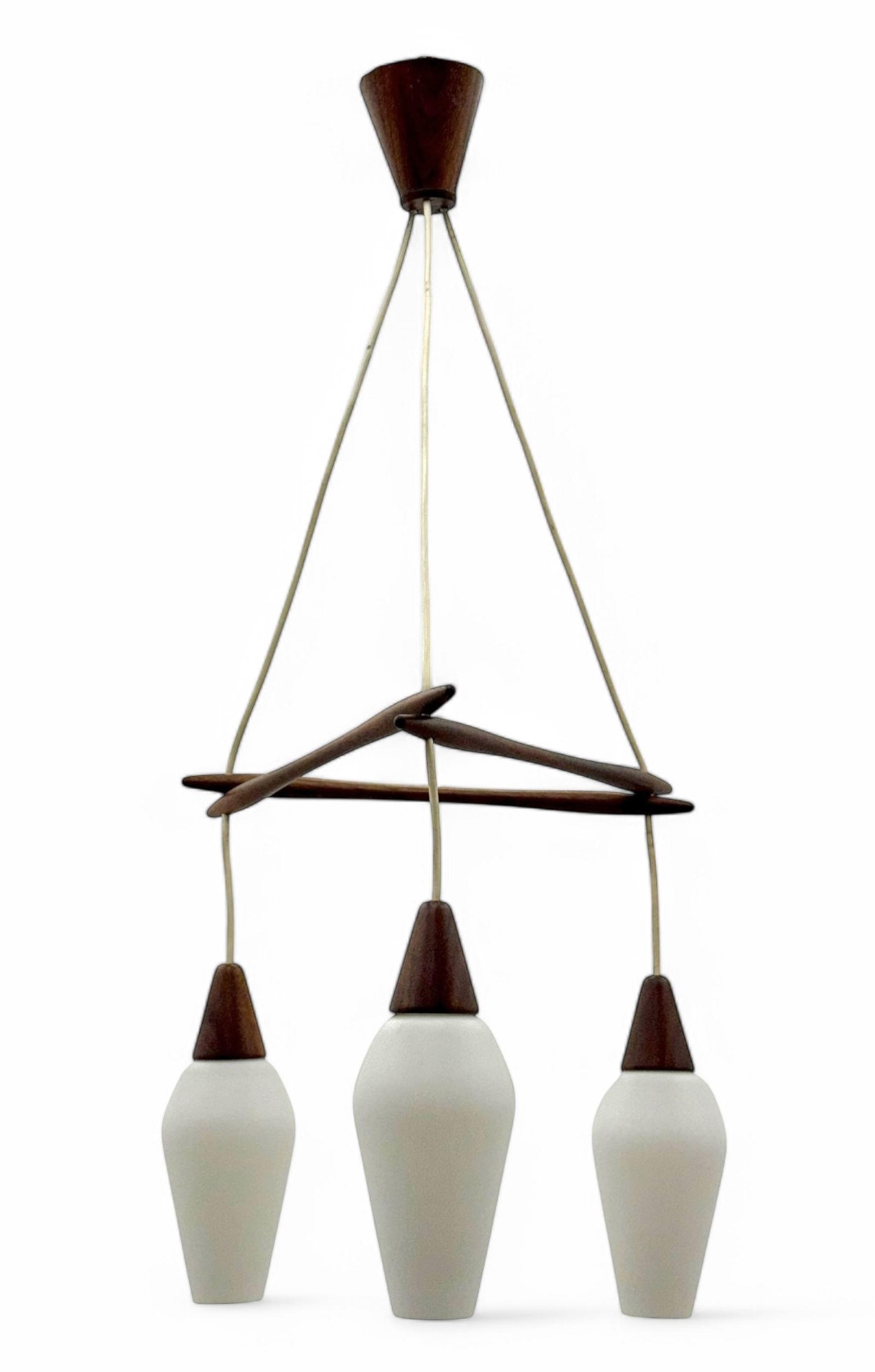 1970's Scandinavian teak three light centre light fitting, with white frosted tapered glass shades, in the style of designer Osten & Uno Kristiansson