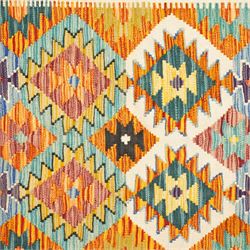 Afghan Chobi kilim flatweave runner with a repeating stepped diamond medallion design in live green, rust, teal, purple, and ivory, framed by chevron and geometric borders