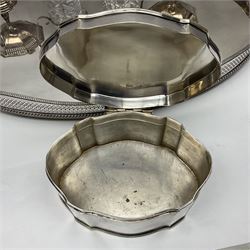Pair of Mappin and Webb silver plate pierced pedestal bon bon dishes, together with other silver plate comprising teapot stand engraved with lion's head to centre, two cut glass claret jugs, two bottle coasters with acorn decoration, two open salts upon dolphin mounts, tea caddy, three piece cruet set and a large oval tray with pierced sides and upon four ball feet