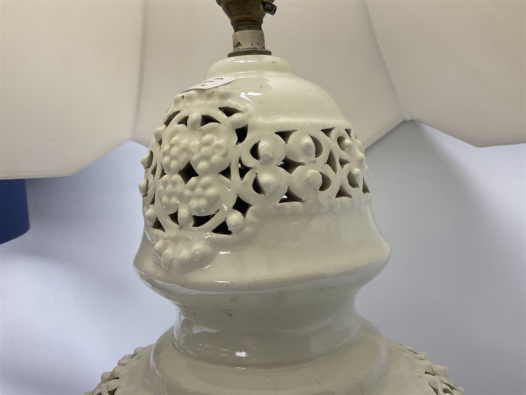 Modern pierced oriental white ceramic vase shaped table lamp, together with a blue and white baluster shaped example decorated with figures upon elephants, both with shades, tallest H83cm incl shade