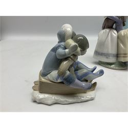 Three Lladro figures, comprising Hang On!, no 5665, Sharing Secrets, no 5720, and Fantasy Friend, no 5710, all with original boxes, largest example H22cm