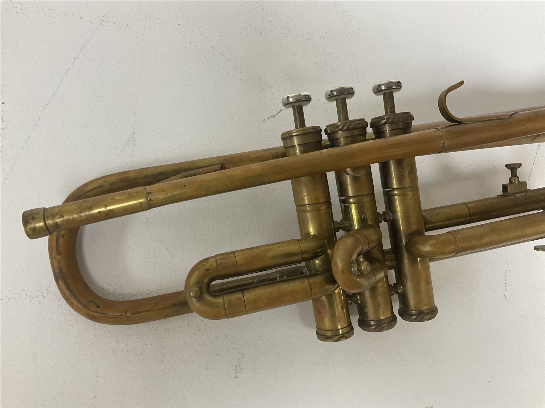 Three brass trombones comprising Elkhart Ind. USA 'CONN' model no.72H; Besson 'Concord'; and Selmer Distributed 'Lincoln'; two in carrying cases; and German B & M 'Champion' brass trumpet (4)