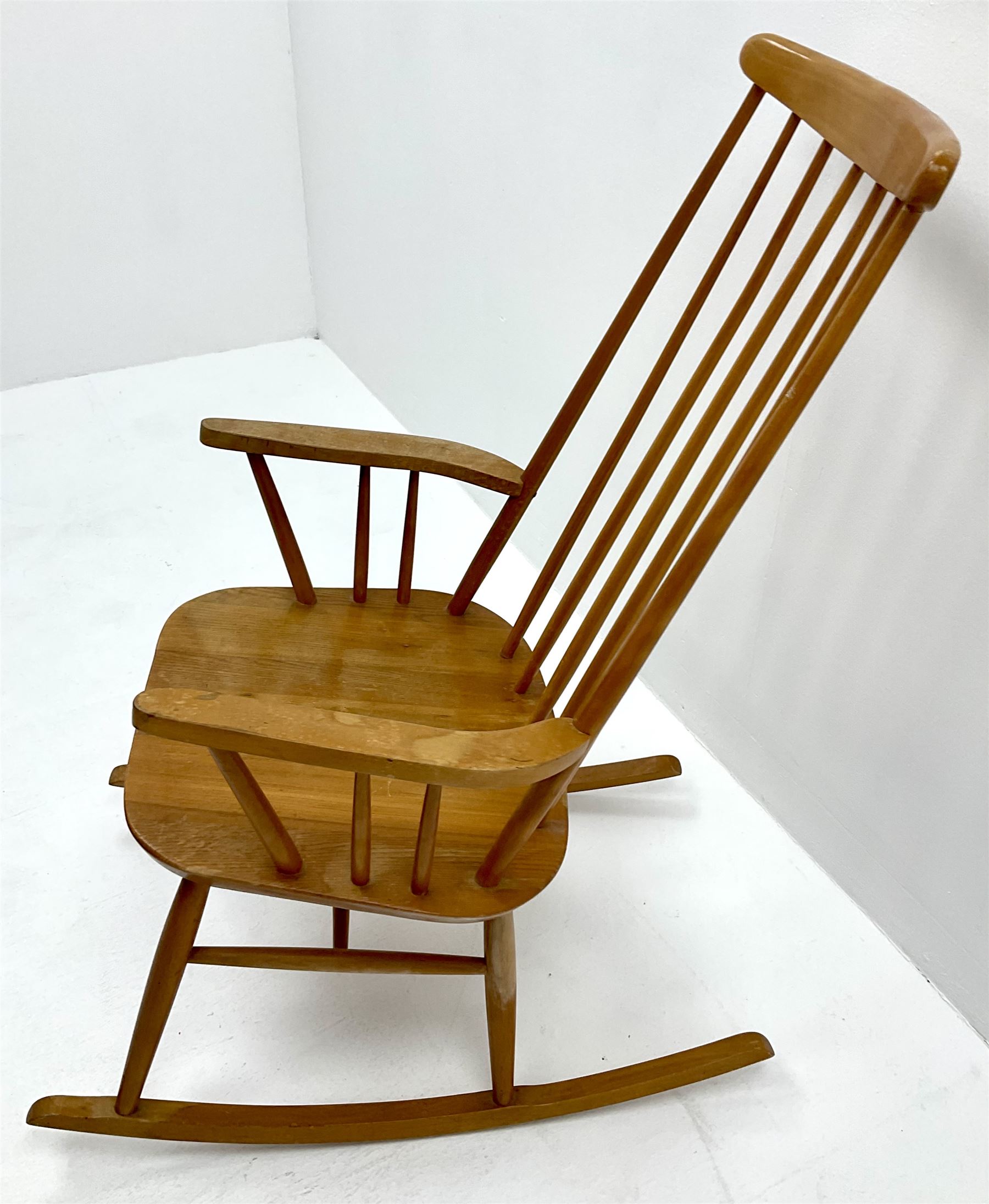 Ercol style elm and beech rocking chair, stick back, turned supports
