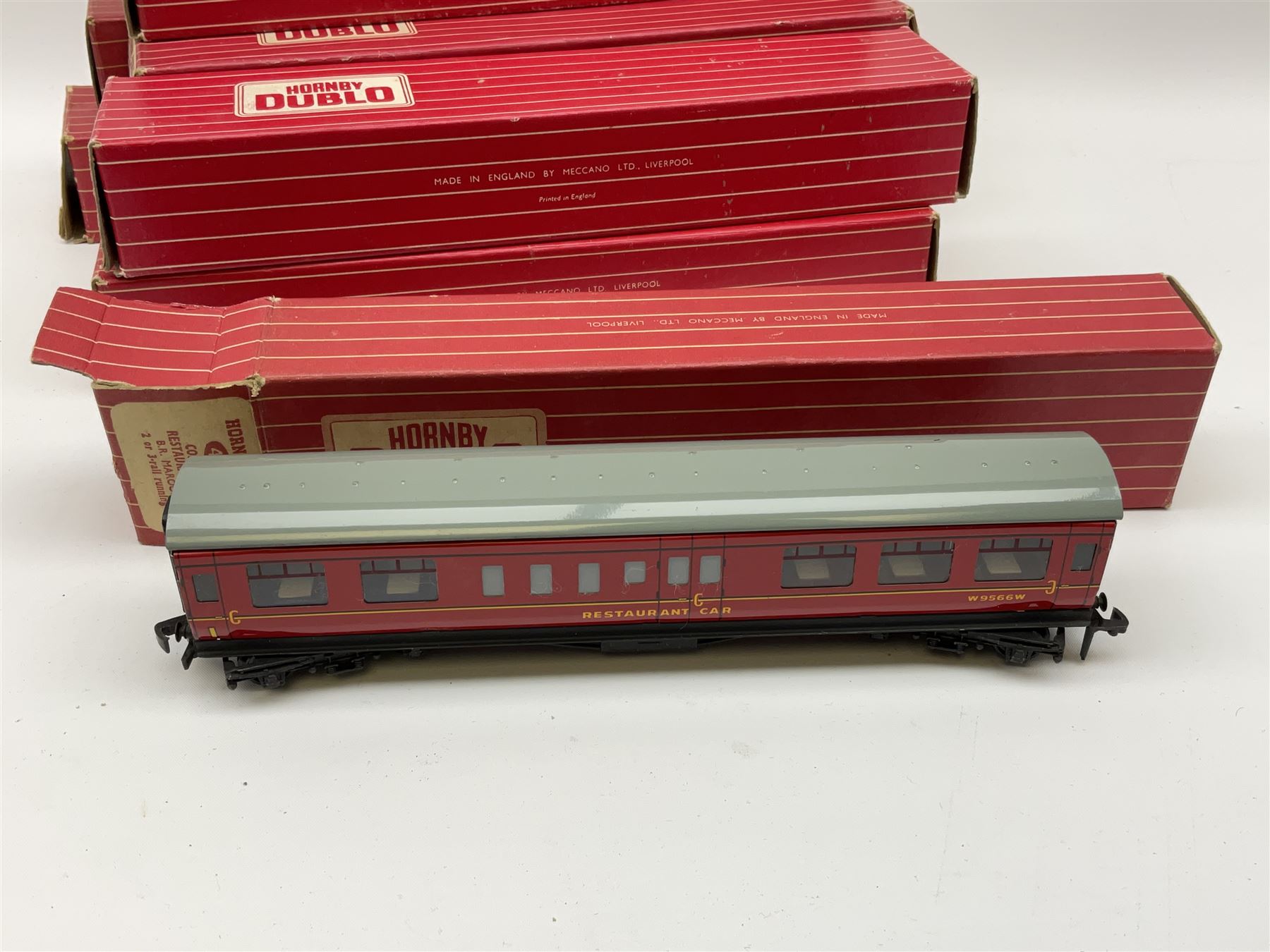 Hornby Dublo - eight coaches comprising 4047 Composite Restaurant Car W.R. (D20); 4049 Composite Restaurant Car B.R. Maroon; 4052 Corridor Coach 1st/2nd B.R.; 4061 Open Corridor Coach 2nd Class W.R.; 4062 Open Corridor Coach 1st Class B.R.; 4063 Ope Corridor Coach 2nd Class B.R.; and two 4078 Composite Sleeping Car B.R.; all in boxes (8)