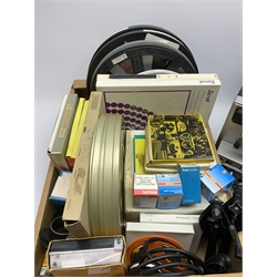 Two 'ELMO Sound ST-1200D' super 8 sound projectors, one in a carry case with photocopy of the original instruction manual, together with various film reels, spare bulbs and other accessories