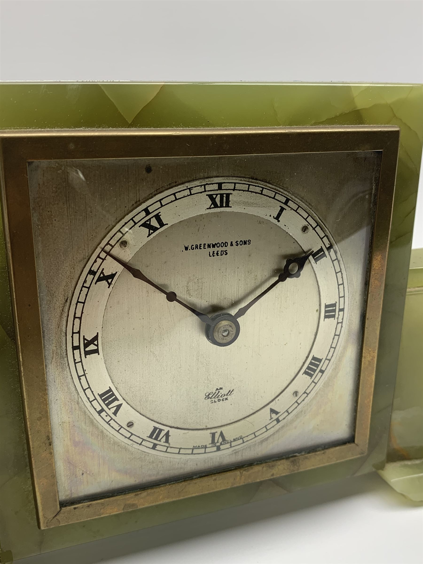 Mid to late 20th century green onyx mantel clock timepiece by 'Elliot', the square silver dial with Roman chapter ring, signed 'W. Greenwood & Sons Leeds'