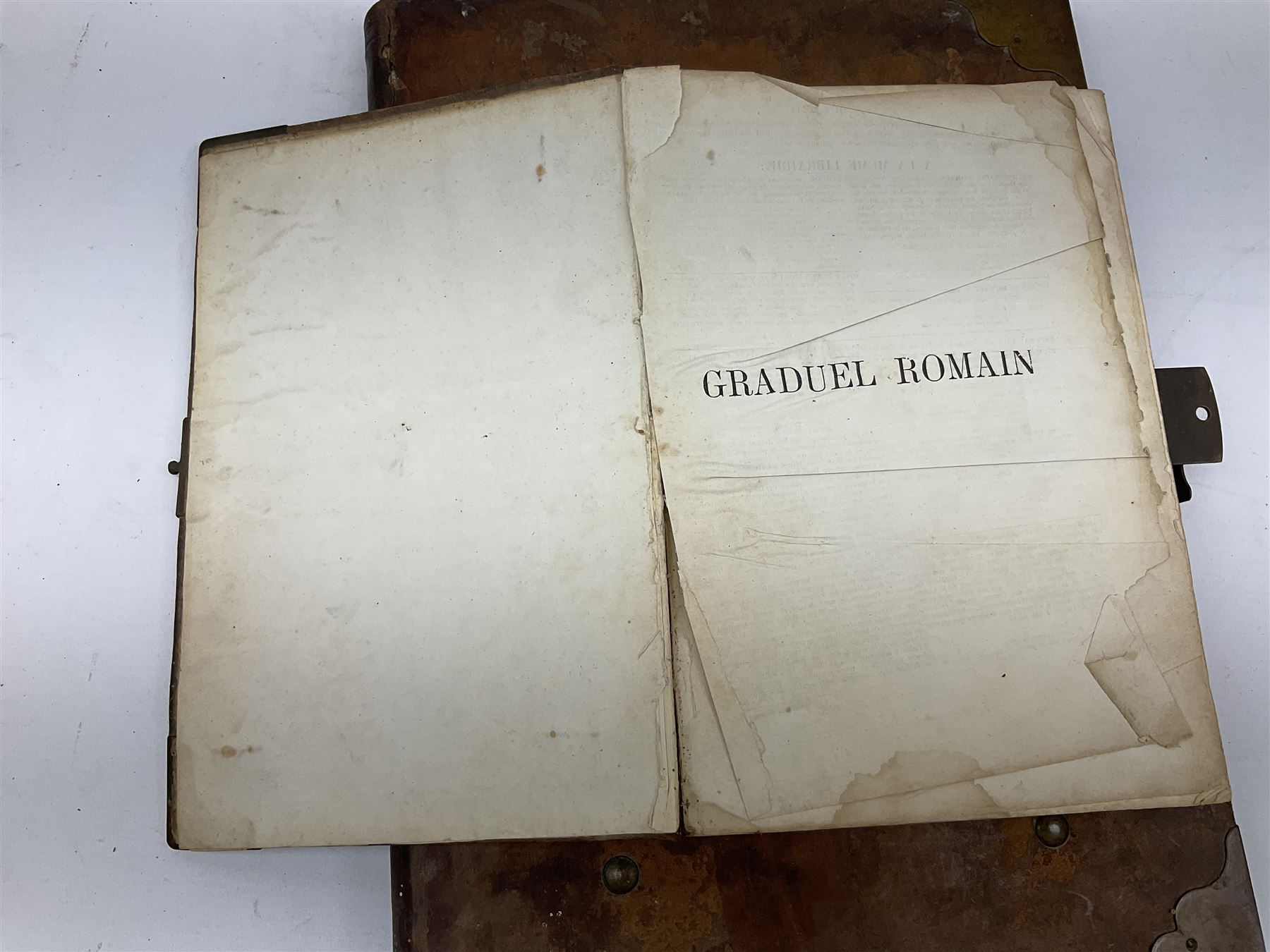 Six 19th century leather bound books of music comprising Graduale Juxta Missale Romanum and Antiphonarium Romanum. Both 1828 Divione; Graduel Romain and Psautier Romain. Both 1859 Digne/Paris; Graduel Romain. 1872 Marseille; and Missale Romanum. 1853 Mechliniae (6)