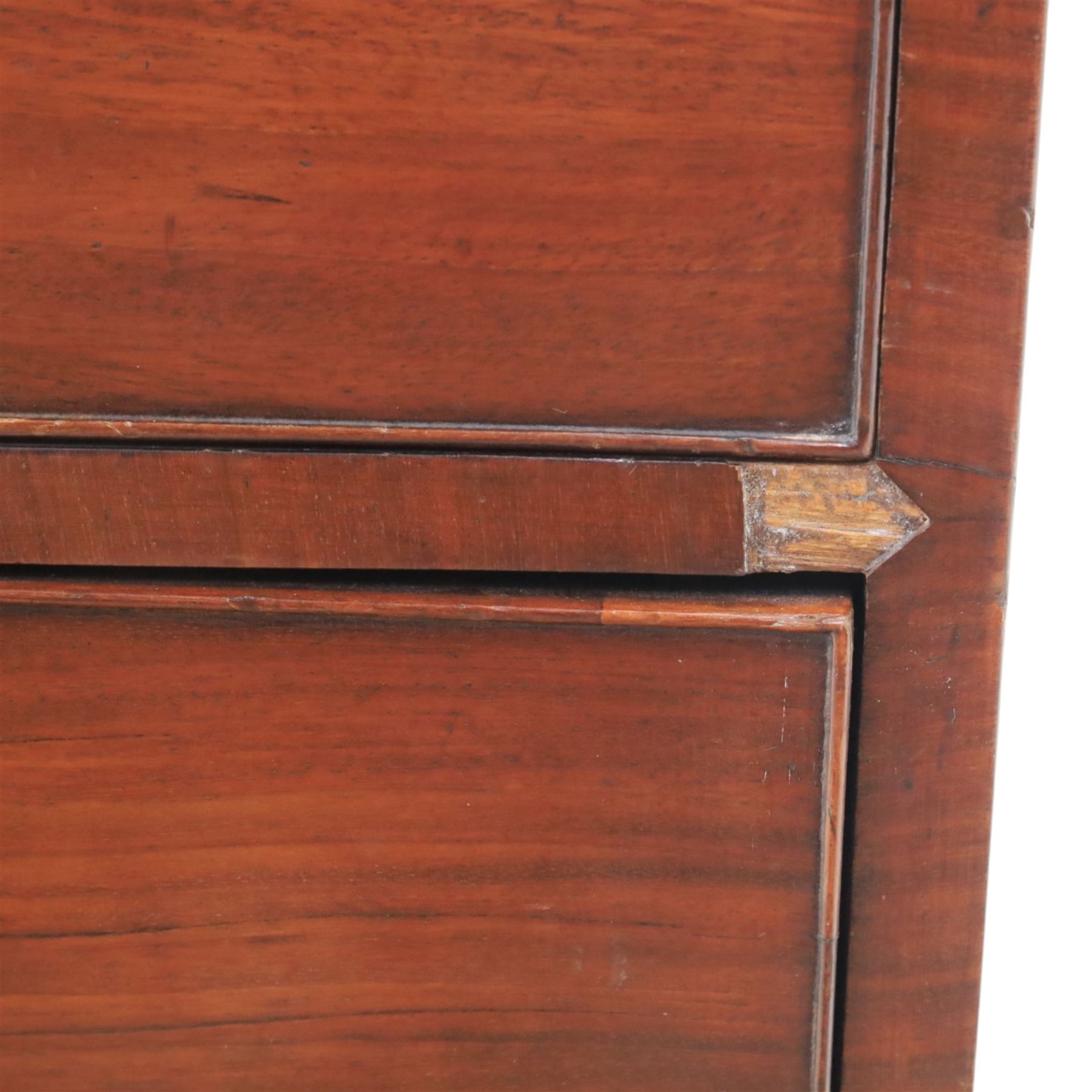 Early 19th century mahogany chest, fitted with short and two long drawers, crossbanded top, raised on bracket feet