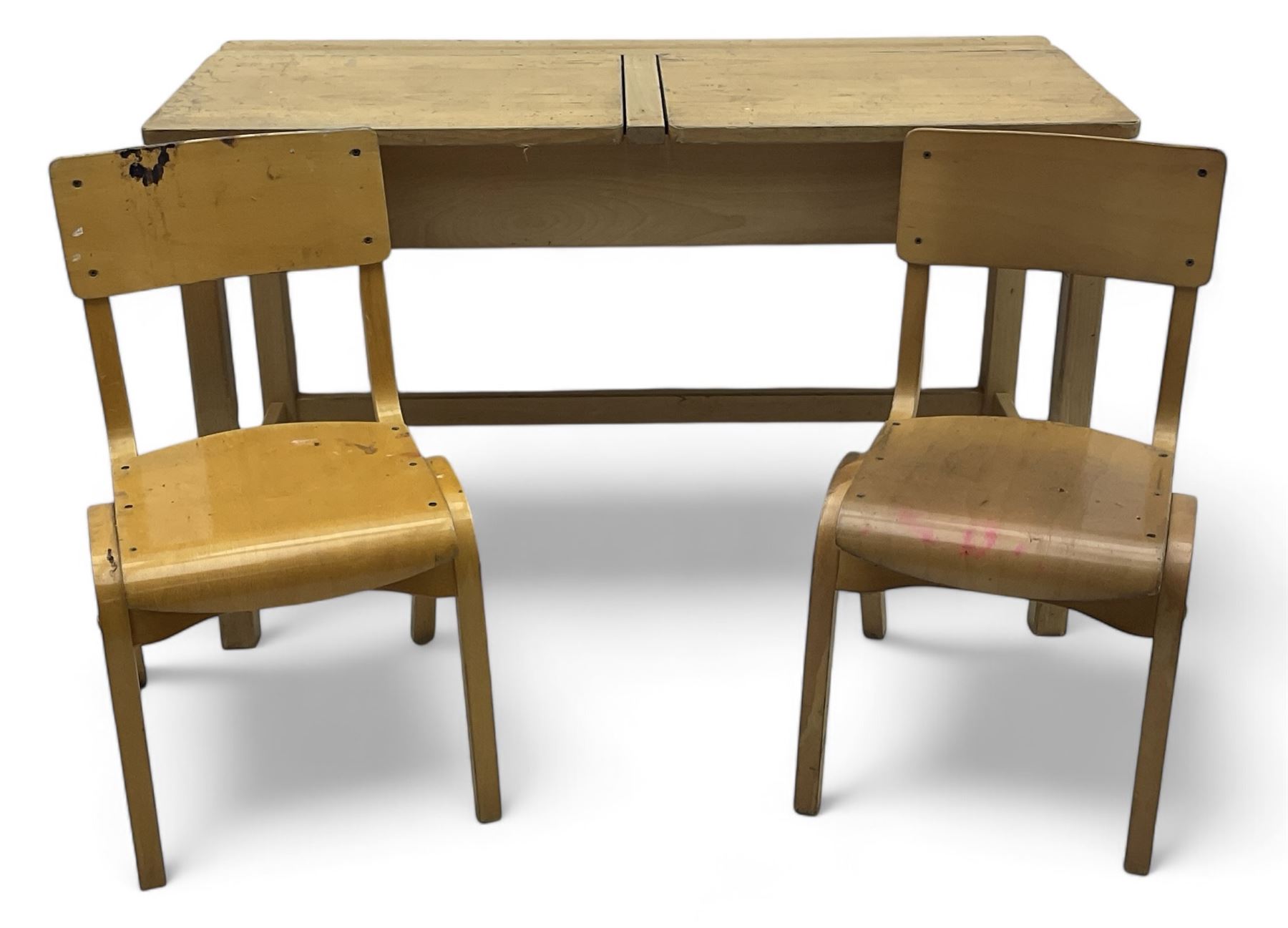 Mid-20th century beechwood school desk, rectangular lift-top desk with storage compartment, supported by square legs with cross stretchers; two matching beech chairs (3)