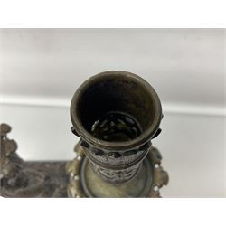 Pair of late 19th/ early 20th century brass candlesticks in the form of dolphins upon a stepped base with Fleur-de-lis design, H32cm 