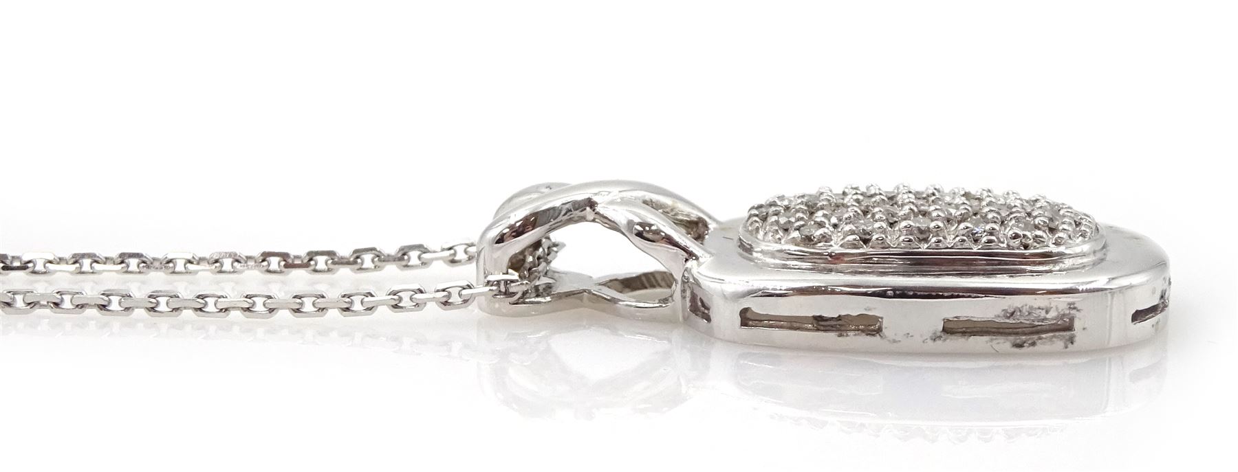14ct white gold pave set diamond pendant, on 9ct gold chain