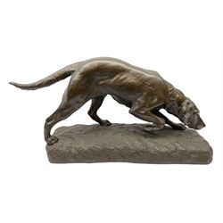 After Georges Gardet 1863-1939: A bronze effect study of a dog hunting, signed Georges Gardet, H29cm, L54cm