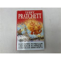 Collection of twenty-three hardback Terry Pratchett books, comprising approximately eighteen first editions including The Fifth Elephant signed & inscribed by Pratchett, all with dustjackets