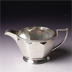  Silver tea set comprising teapot, hot water jug, sugar bowl and milk jug of circular panel sided design Sheffield 1941 Maker Harrison Brothers & Howson 