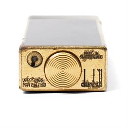 Dunhill - Rollagas lighter, lapis blue lacquer and gilt metal, with ribbed thumbpiece, H6.5cm 