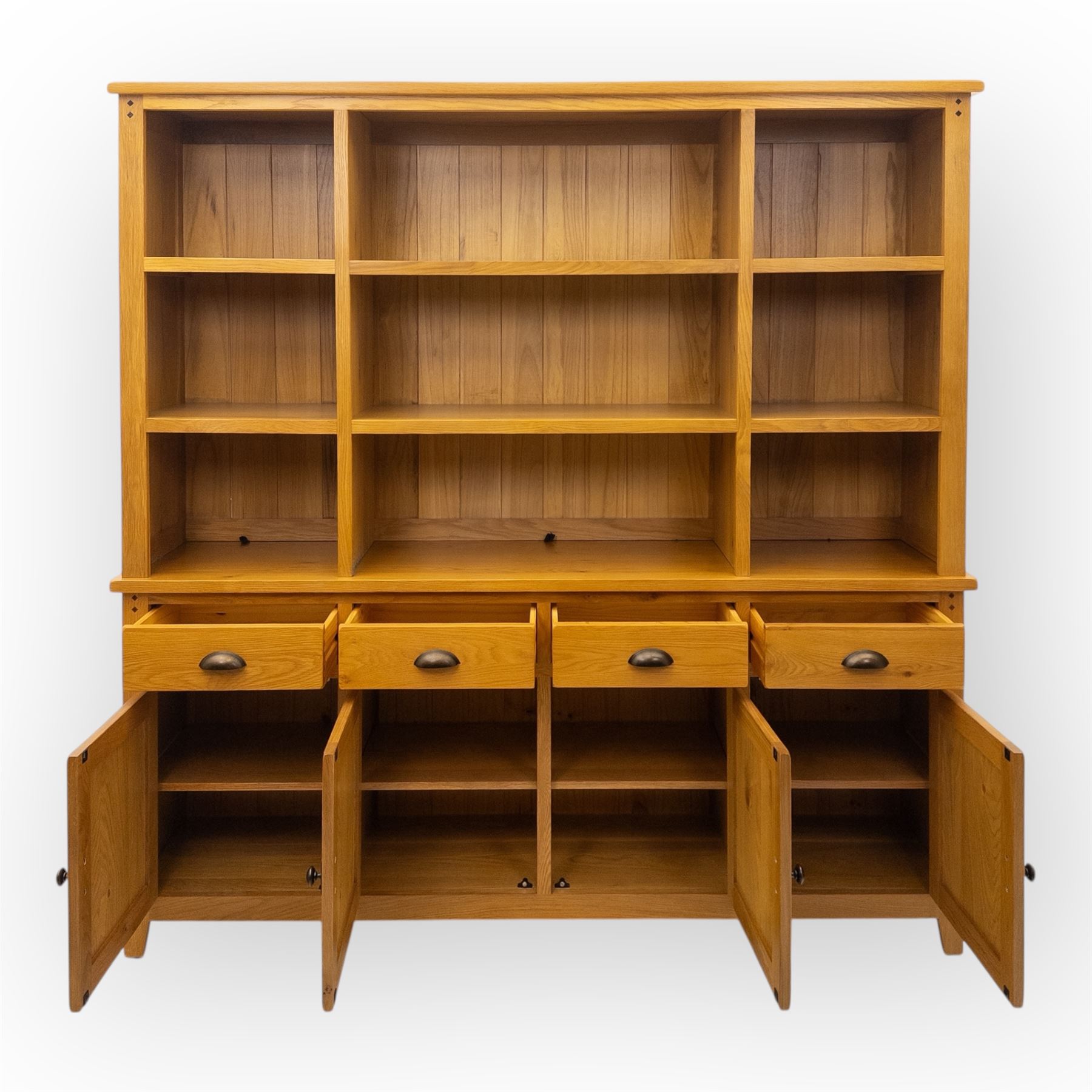 Cotswold & Co - modern light oak dresser, the upper section with open shelving and divided compartments, the base fitted with four drawers over four panelled cupboard doors with metal handles