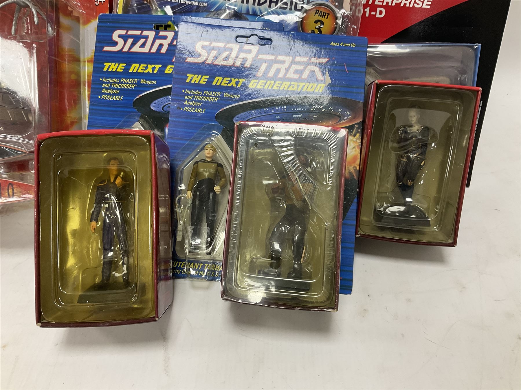 Star Trek - Eaglemoss Official Starships Collection three unopened issue No.1 and Issue No.2; five boxed Fabbri metal figures; and four carded action figures; together with Dr. Who - Eaglemoss Official Figurine Collection unopened Issue No.1; Dr. Who Monster Invasion parts 2 & 3, both unopened; four Dapol carded Dr. Who action figures and two others.