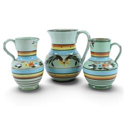 Hartrox Stoneware, comprising five jugs and two bowls, all with green, blue, yellow and oragne floral and abrstact decoration, with printed marks beneath, tallest H26cm