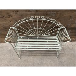 Wrought metal two seat garden bench, sunburst back, painted in pale green finish