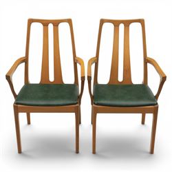 A pair of Nathan 'Highback Carvers' and a 20th century nest of teak tables, (Tables W65cm, D38cm, H49cm)
(Carvers W57, H97)