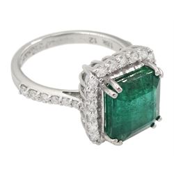 18ct white gold emerald and round brilliant cut diamond cluster ring, with diamond set shoulders, stamped 18K, emerald approx 4.85 carat, total diamond weight approx 0.70 carat
