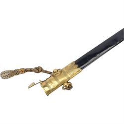 George V midshipman`s dirk, the 45cm straight single edged blade, length etched with crowned GRV cypher and anchor foliate scrolls, gilded brass hilt with lion`s head pommel and wirebound fishskin covered grip, in brass mounted leather sheath, the upper mount engraved  'C.R.B', with a cord and wire knife knot, overall L6cm` 
