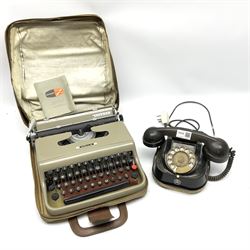 Vintage black telephone, marked 'Bell Telephone MFG Company', with Bakelite headset and brass dial, together with soft case travel Olivetti 'Lettera 22' typewriter with manual