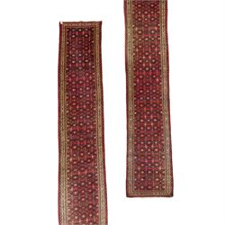 North West Persian runner, red field decorated with repeating herati motifs and small flow...
