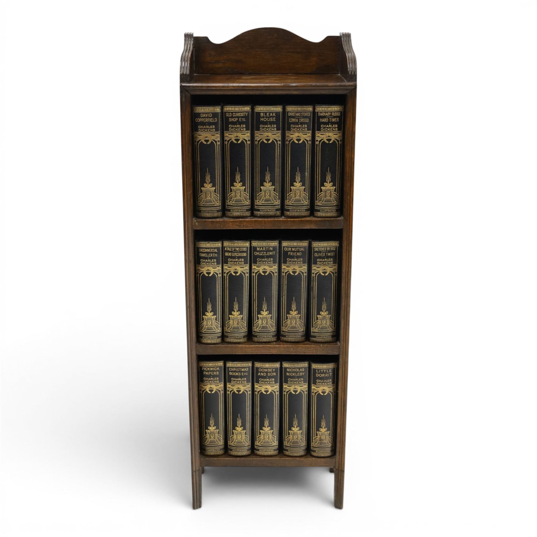 Small Edwardian mahogany open bookcase with Charles Dickens books, oak bookcase with galleried top, containing fifteen hardback books  