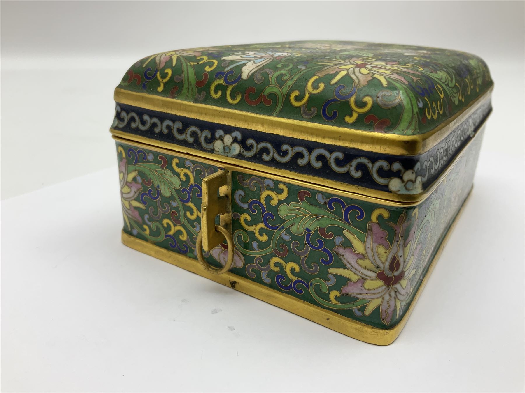 20th century Chinese cloisonne enamel smoking set, comprising two ashtrays, box and tray, with floral and foliate scrolling on green ground