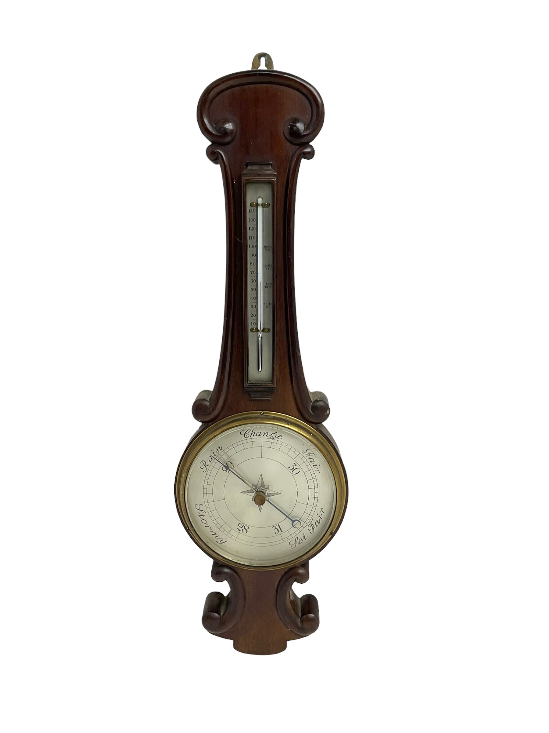 Early 20th century aneroid barometer c1910 in a scroll carved mahogany