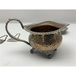 Silver plated tray, with shaped rim and embossed with a dog and crown to centre, stamped Valenti, together with three silver plated decanter labels, two port and one Bucellas, a plated cream jug with embossed floral decoration and a pair of plated fish knives engraved with double headed eagle to handle, tray W25.5