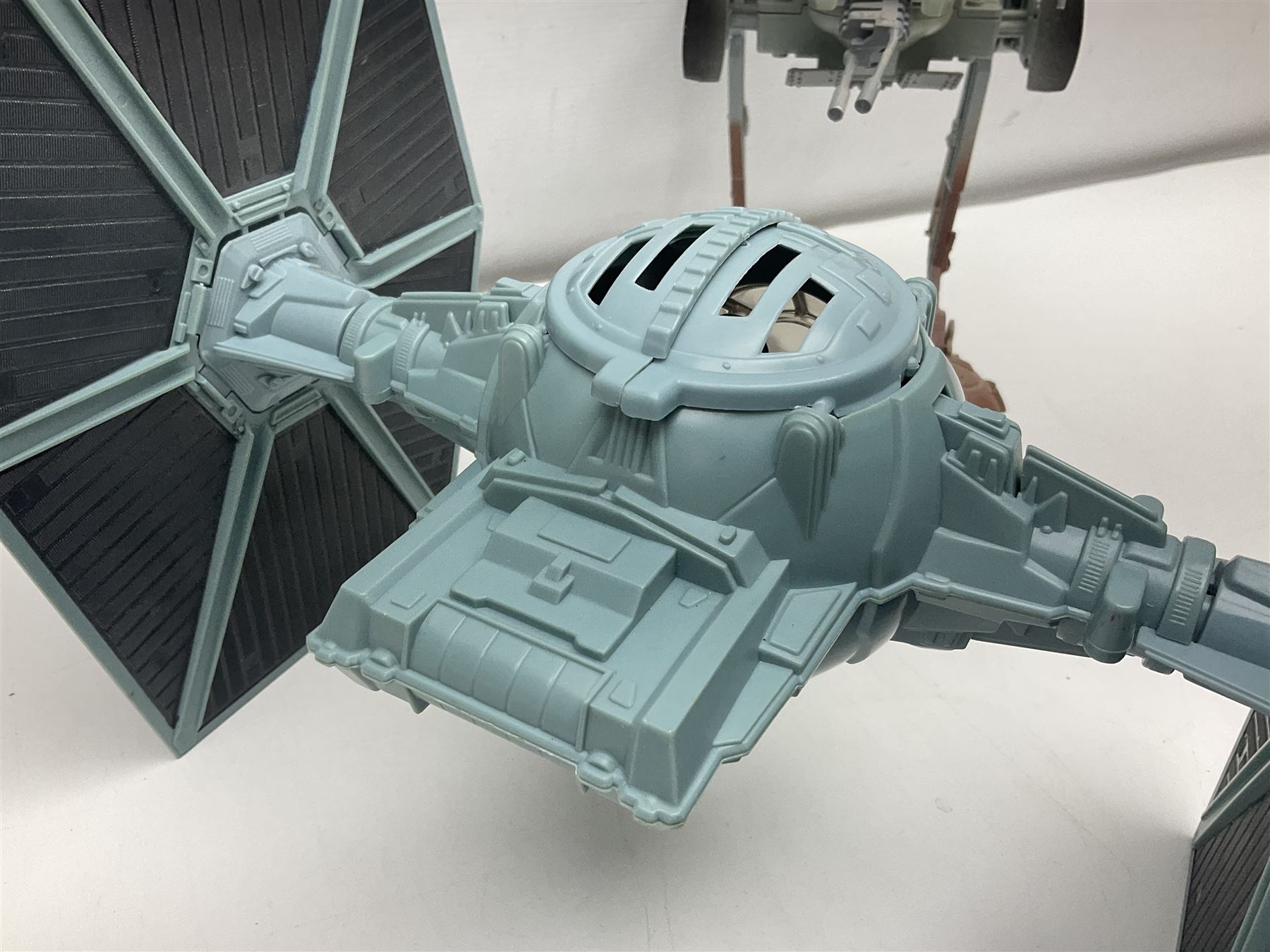 Star Wars - four space/land vehicles comprising Millenium Falcon with hinged top and figures; TIE Fighter; X-Wing Fighter with pilot; and AT-ST 'Chicken Walker' transporter; all unboxed (4)