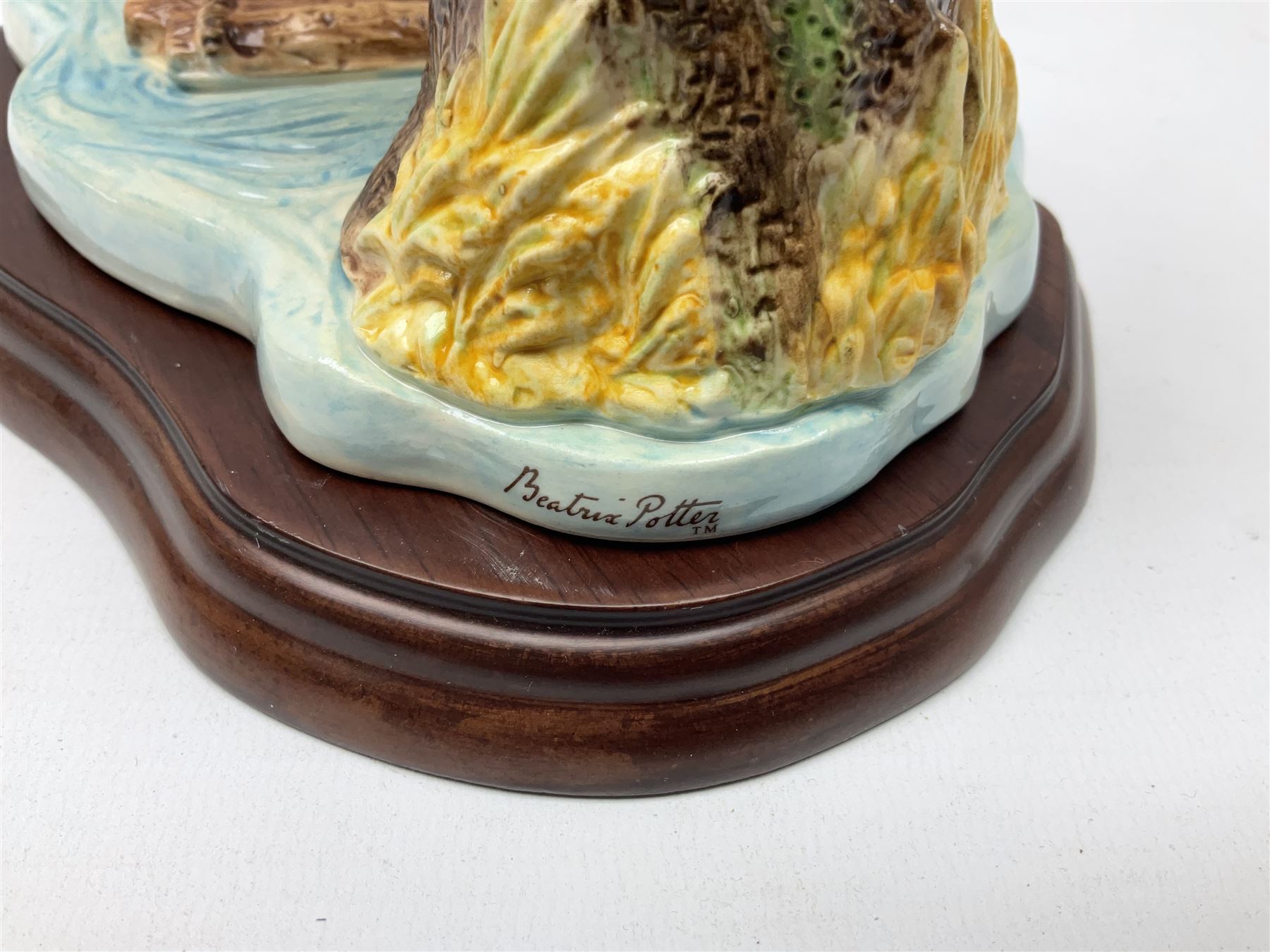 Four Border Fine Arts Beatrix Potter figures, comprising Tableau created to commemorate the Millenium together with a Border Fine Arts Limited Edition no 669814, The Tale of Peter Rabbit Tablet A1306, Four Little Rabbits A2442 and Sailing Home A2443