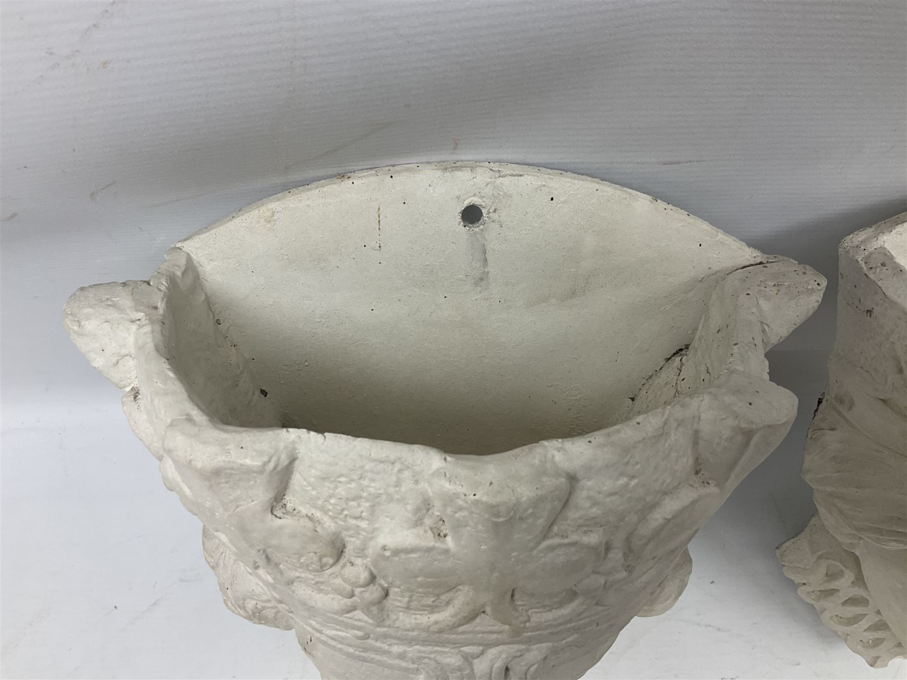 Pair of concrete wall planters in the form of a medieval King and Queen, painted white, L28cm