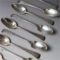 Eleven Victorian silver teaspoons, profusely engraved with floral decoration throughout with family crest to terminal, hallmarked Elkington & Co, Birmingham 1875