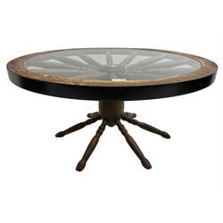 Oak framed 'ships wheel' coffee table, circular top with inset glazed surface, spoke and wheel supports on matching base