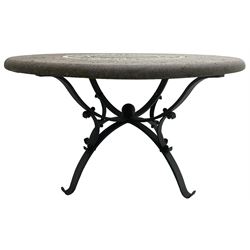 Granite and wrought metal garden table, circular granite top inlaid with geometric design mosaic band, on scrolled work wrought metal base with four splayed supports 