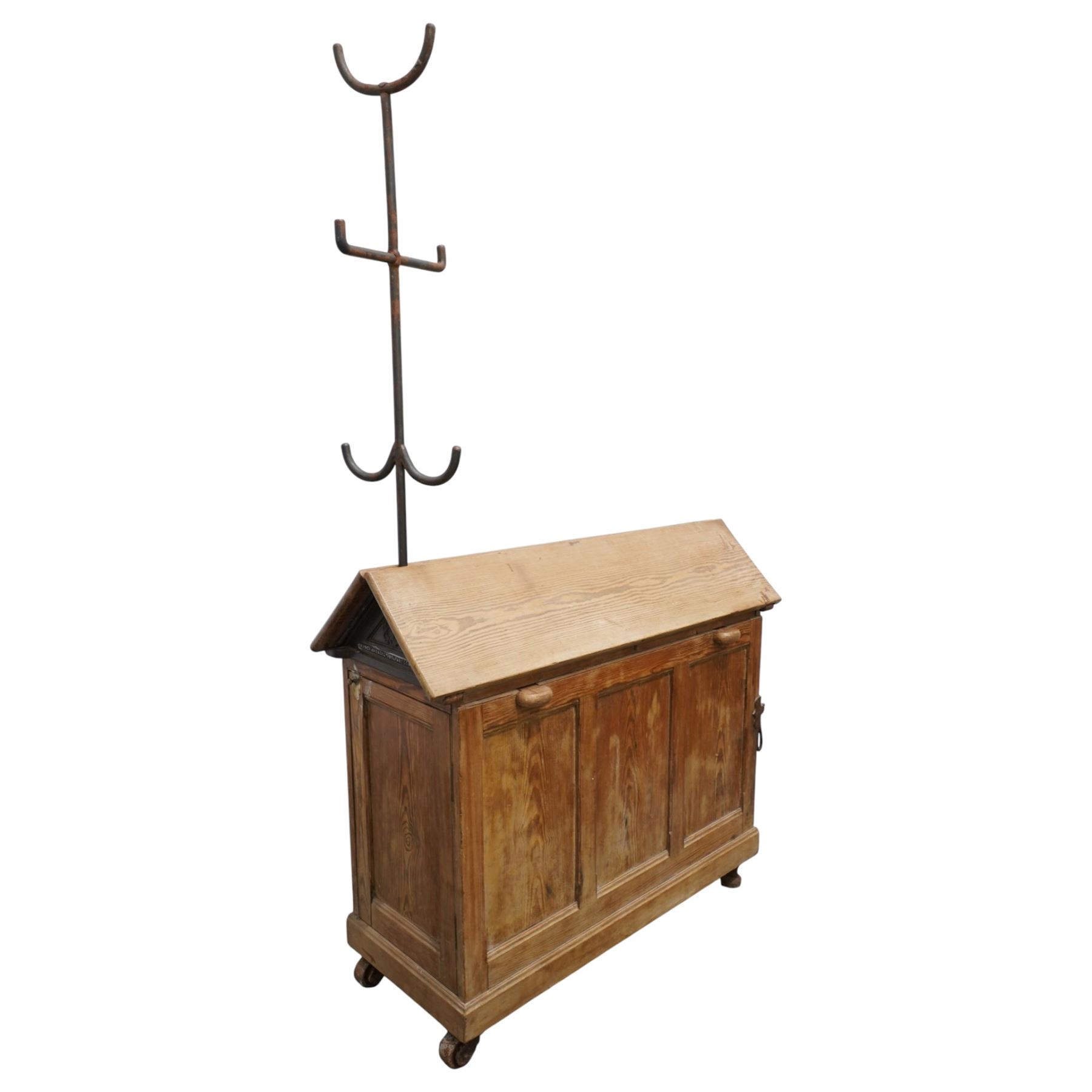 Musgrave & Co Ltd (Belfast) - late 19th century pine saddle horse, with three drawers to one end and cupboard door to the other, the hinged top opening to form a table, the cast iron plaque bears the Royal coat of arms and maker's name