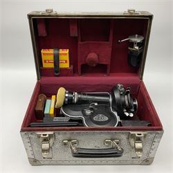 Arriflex 16SB camera body, serial no. 1784, with ' Carl Zeiss Distagon 1:2 f=8mm' lens, serial number 3860224, 'Carl Zeiss Jean Tessar 2/16' lens, serial no 3624355, camera pistol grip and other accessories, in fitted hard case