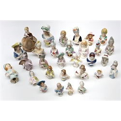  Group of thirty half pin cushion dolls of varying sizes, one with pin cushion base, L10cm max   