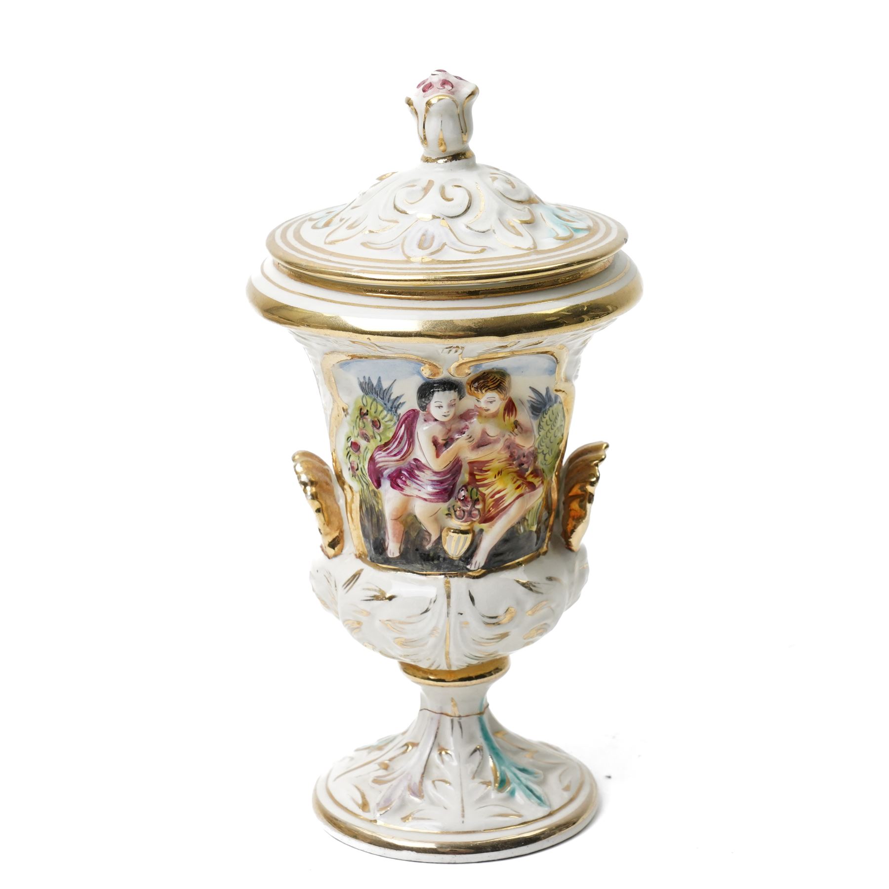 Capodimonte vase and cover decorated with a raised pattern of cherubic figures H32cm, another vases and cover with panels of figures H33cm, bowl and cover with similar decoration D20cm and two other Capodimonte pieces (5)