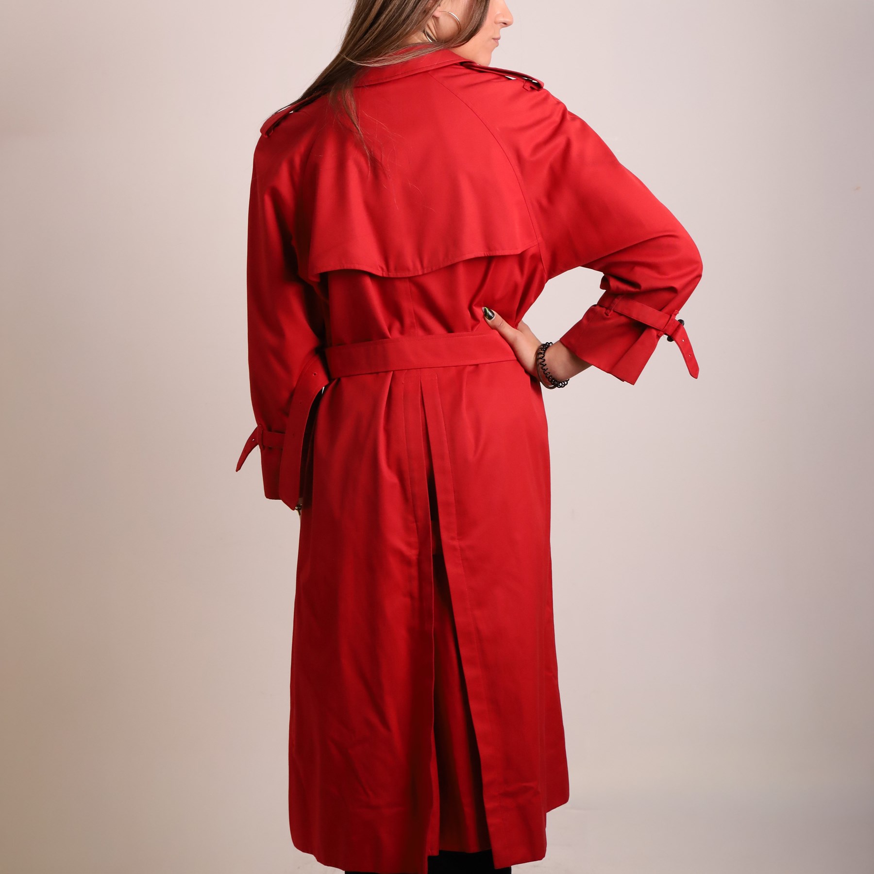 Burberrys and Aquascutum - two vintage trench coats, comprising a Burberrys red cotton trench coat with navy, red and grey check lining, labelled Burberrys, Made in England, and an Aquascutum beige cotton trench coat with house check lining, labelled Aquascutum, Made in England, both size L (2)