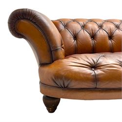 Tetrad - 'Oskar' grande three-seat sofa, Chesterfield shape with rolled arms, upholstered in buttoned tan leather, on turned and reed moulded feet 