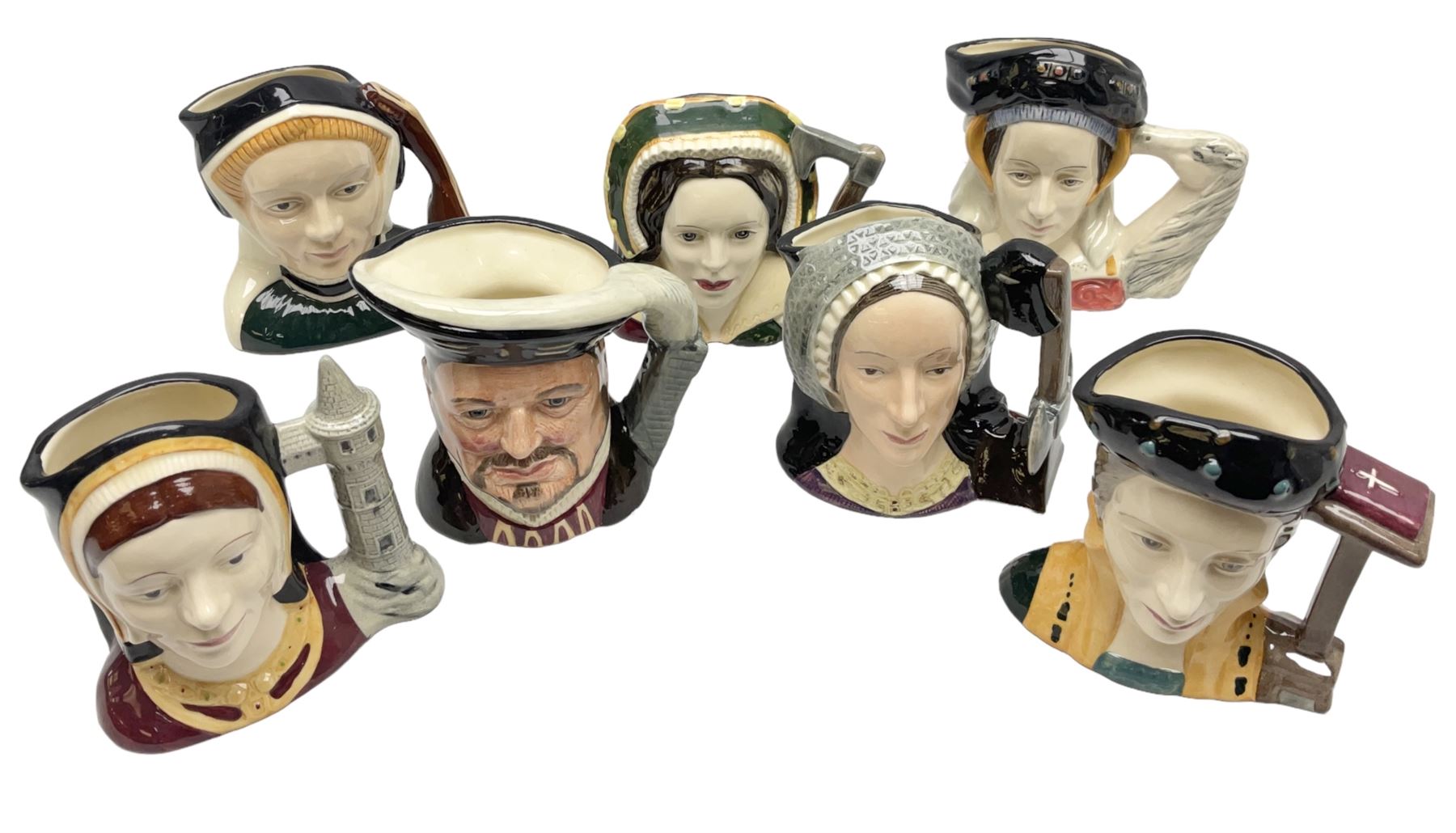 Royal Doulton Henry VIII and his Six Wives Character Jugs, comprising of Henry VIII D6647, Catherine of Aragon D6657, Anne Boleyn D6650, Jane Seymour D6746, Anne of Cleves D6753, Catherine Howard D6692 and Catherine Parr D6751, tallest H10cm