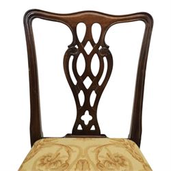 Large 19th century mahogany extending dining table with set of Chippendale design chairs, extending dining table with rectangular moulded top additional three leaves, raised on turned supports terminating in brass castors, the dining chairs (2 + 2) with shaped cresting rail and pierced splats, raised on square supports with stretchers