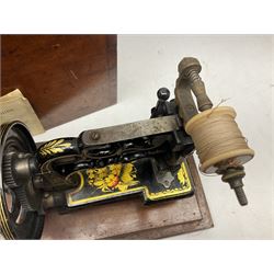James G Weir 'The Globe' hand-cranked sewing machine, circa 1872, in black finish with gilt and flower painted decoration, the bed stamped Ja's G. Weir, 2 Carlisle Street, Soho Sq., London, with walnut locking carrying case and original manual, boxed H25cm 