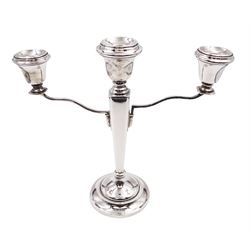Modern silver mounted three branch candelabra, the tapering stem supporting a central candle holder and two removable curved branches with candle holders, upon spreading circular foot, hallmarked Birmingham 1968, maker's mark worn and indistinct, H25.5cm