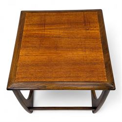 G-Plan - 'Astro' mid mid-century long teak coffee table with two nesting tables, rectangular top with outer banding, above two square top occasional tables on U-shaped end supports united by a stretcher