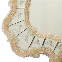 20th century Venetian glass wall mirror, the shaped plate within a mirrored frame applied with clear glass flowerheads and moulded glass edging, with etched floral decoration to the bevelled 'frameless' plates, the inner slip with ropetwist moulded glass
